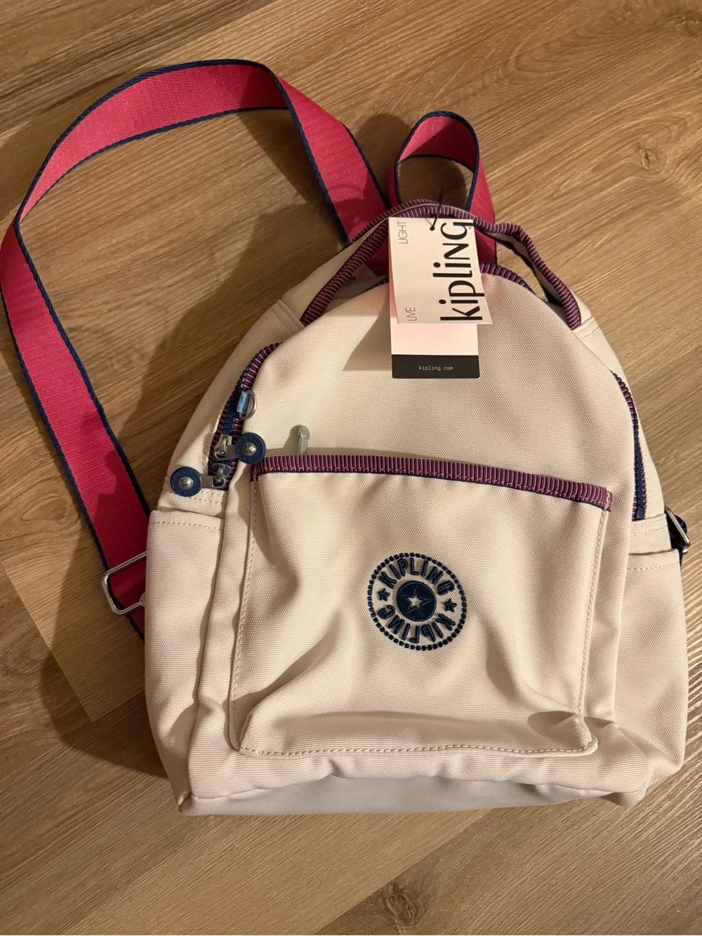 Kipling Cream Kids Backpack with Purple Trim and Blue Charm